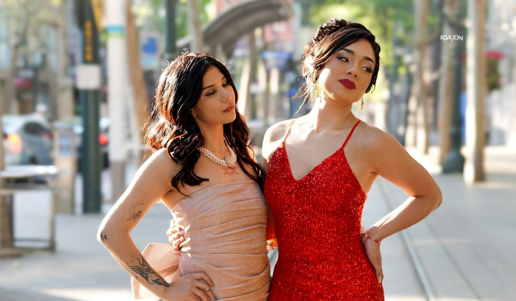 Two women in eveningwear on a city street