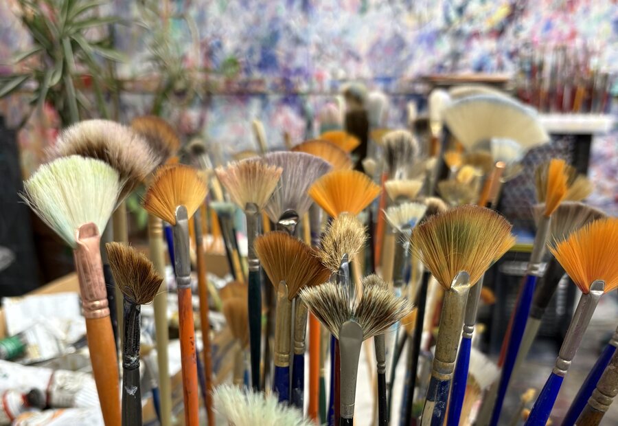 Paintbrushes arranged in an artist's studio